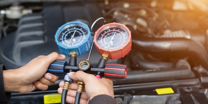 mechanic holding air control valve