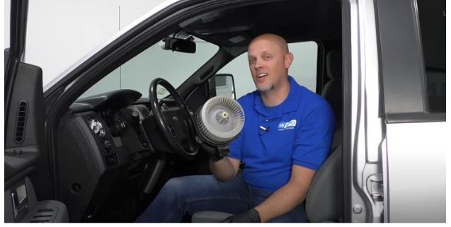 man sitting in his car and showing the blower