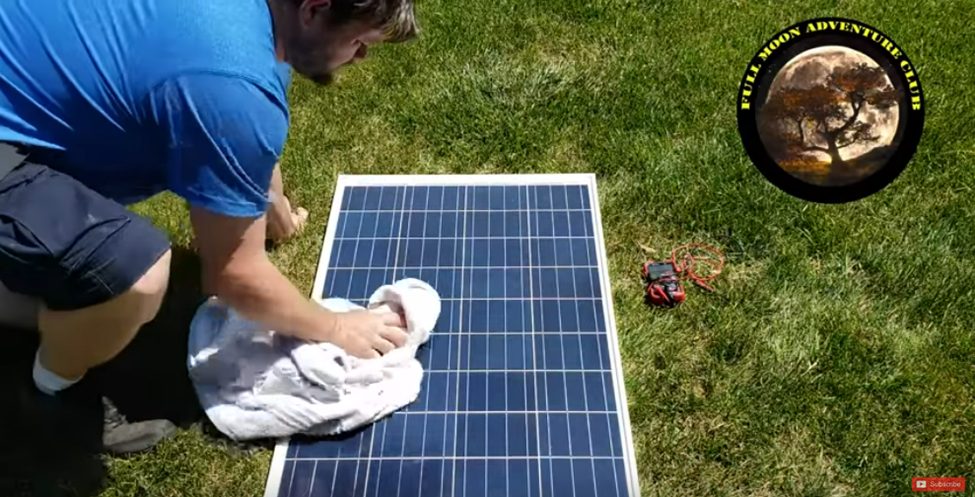 man cleaning up the solar panel