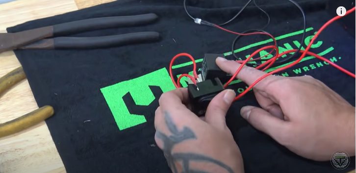 a person connecting the pin relay