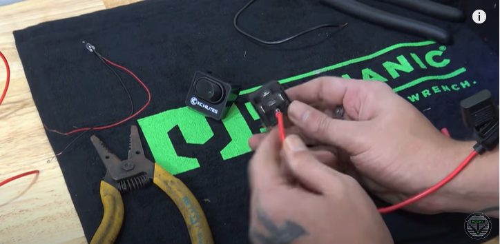a person establishing connection to wires