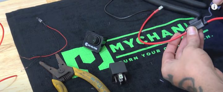 a person locating the headlight wires