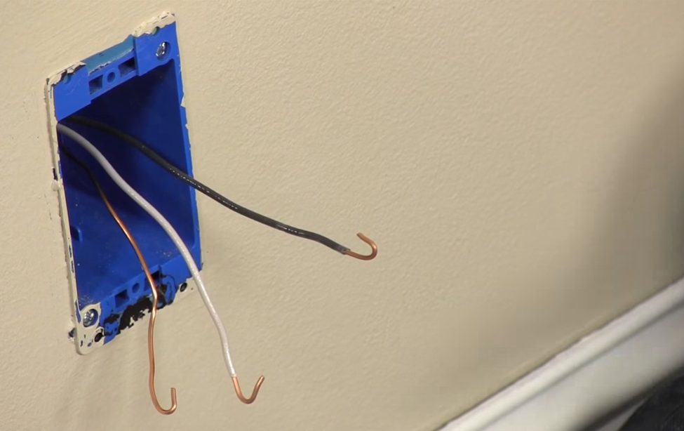 outlet with black, white and silver wires