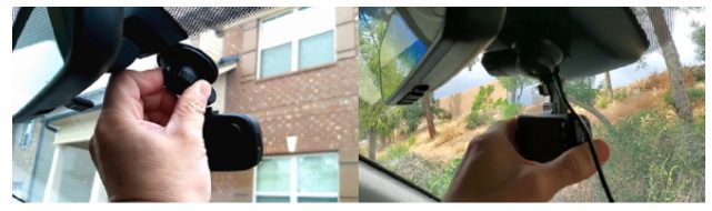 hand holding a mounted dashboard camera