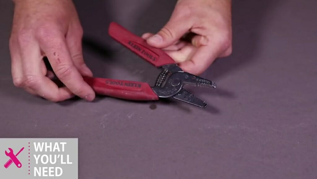 hand holding wire stripper
