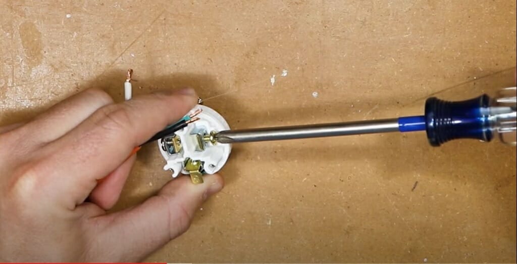 insert the wire into the terminals with screwdriver