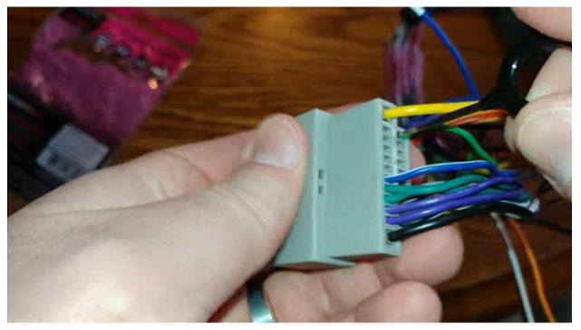 inserting the extraction tool through the extraction hole