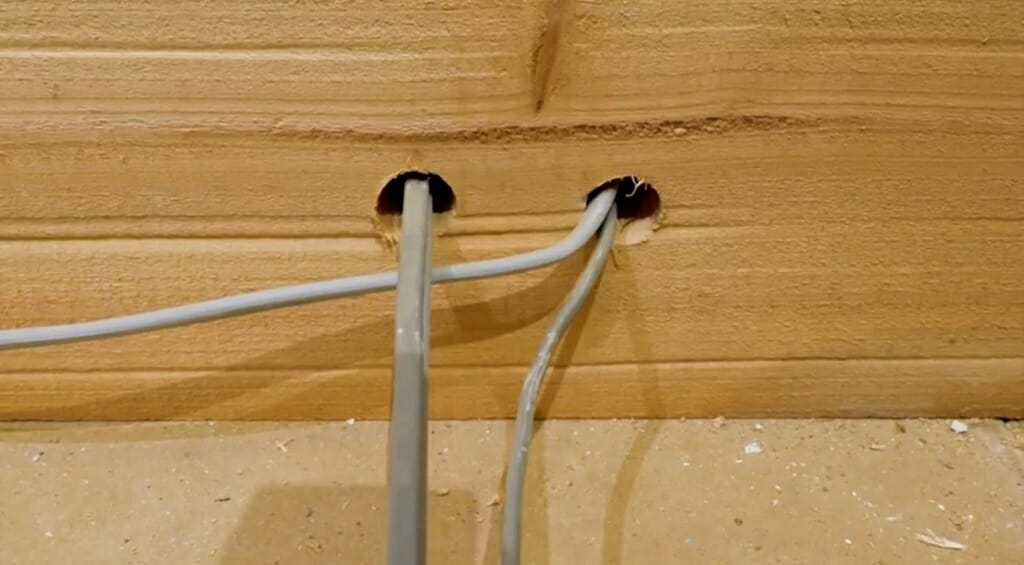 inserting the wires into the holes