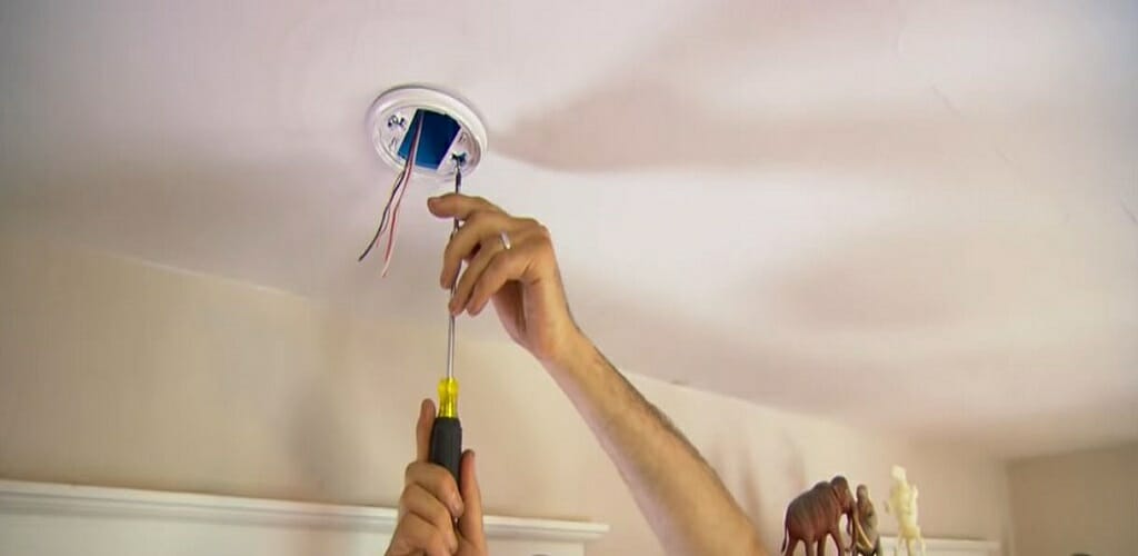 installing the old work boxes using screw driver