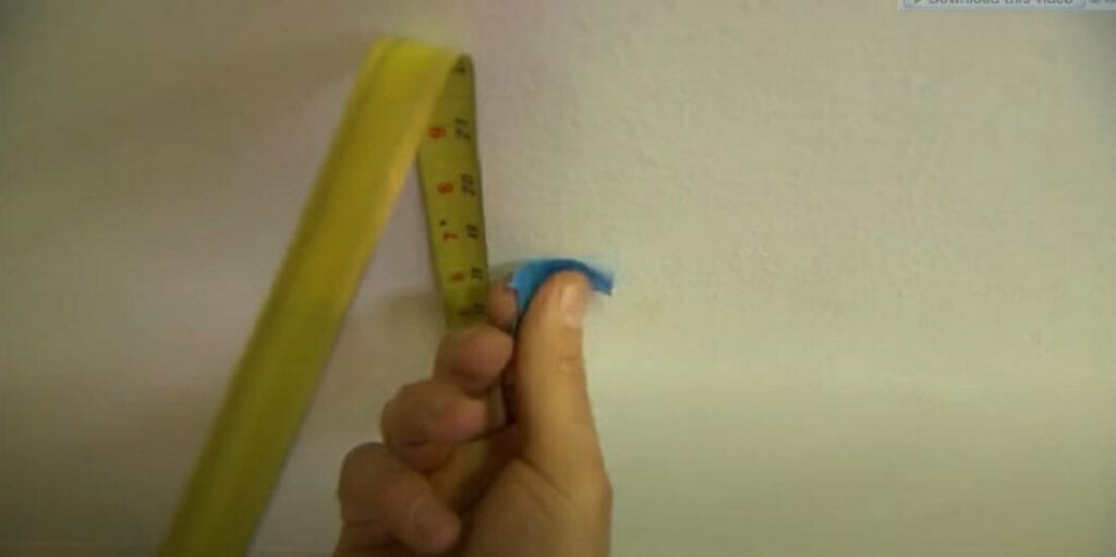 measure and mark the location with tape measure and masking tape