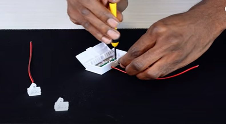 placing the speaker wires in the respective ports