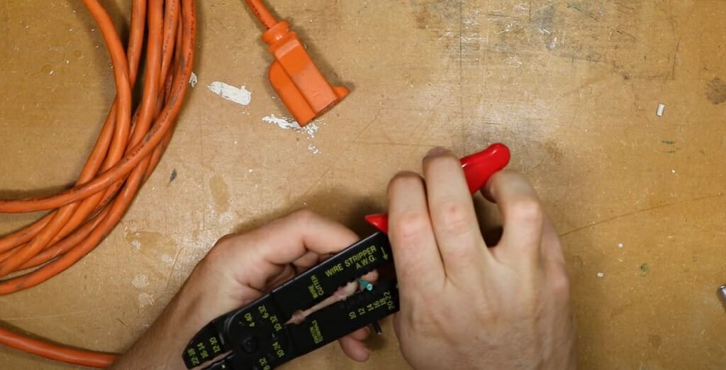 stripping the wires with wire stripper tool