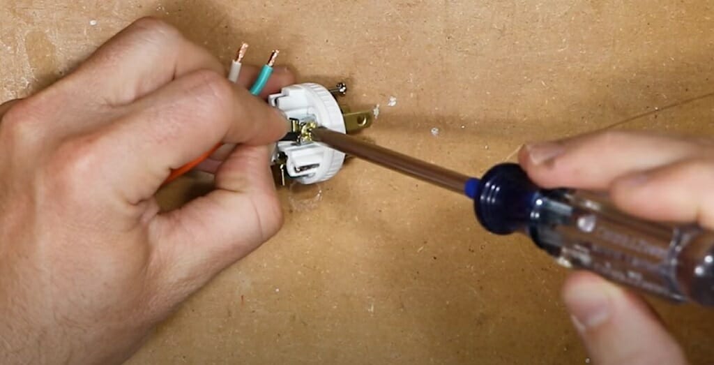 tightening the screw in the male plug