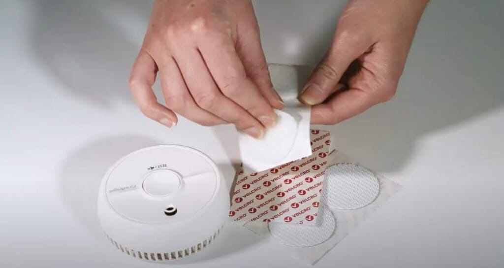 attaching a coin to the smoke detector
