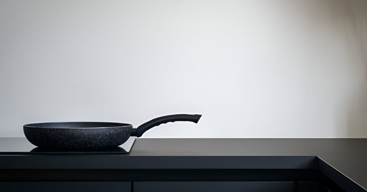 Black stove with black pan in it