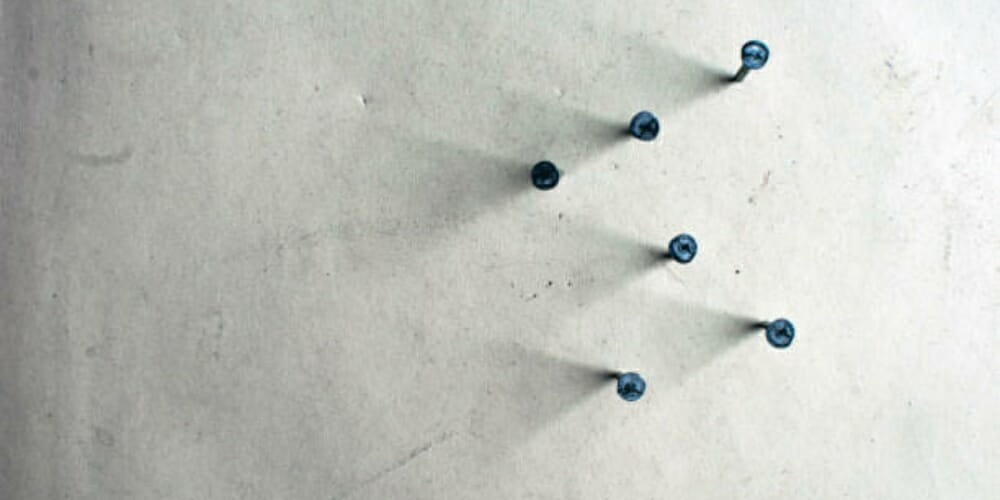 nails on the concrete wall