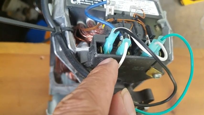 A person showing the wired motor