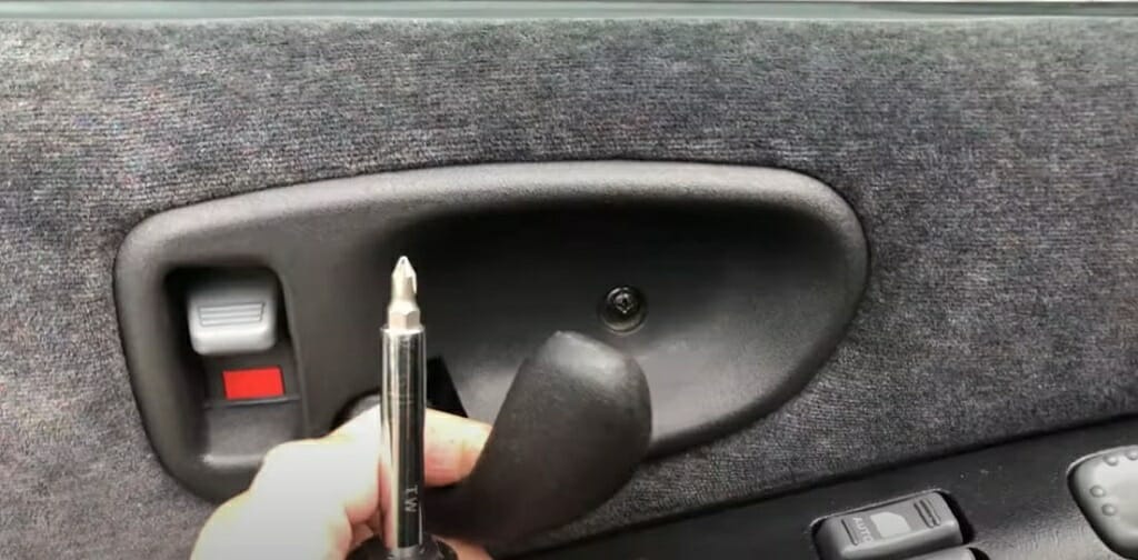 A person is disconnecting the door switch wiring