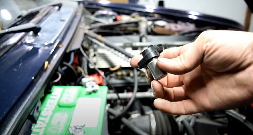 hand holding a crank sensor