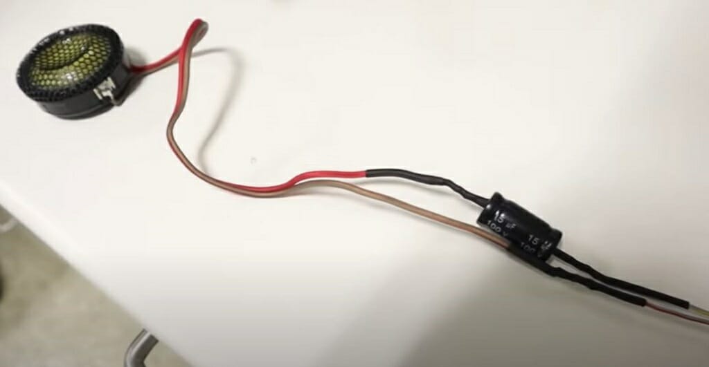 Tweeter and its wires on a white table