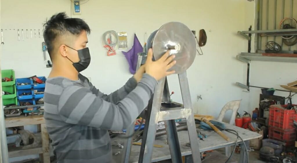 connecting the pulley to the frame