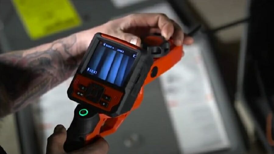 guiding the inspection camera alongside the wires