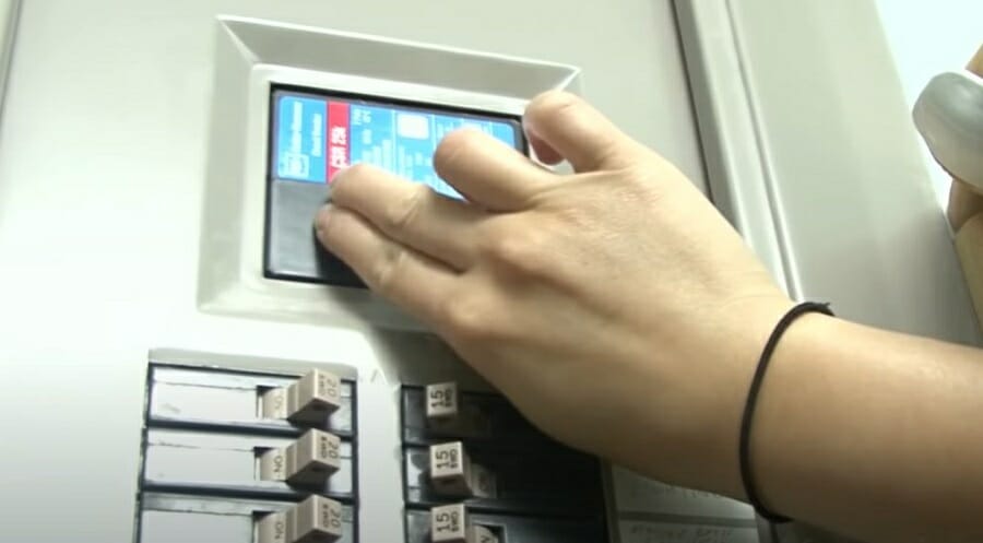 hand cutting off the main power