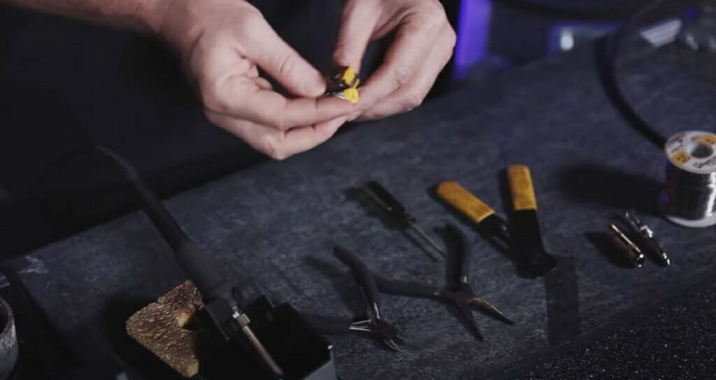 tools for soldering laid on table