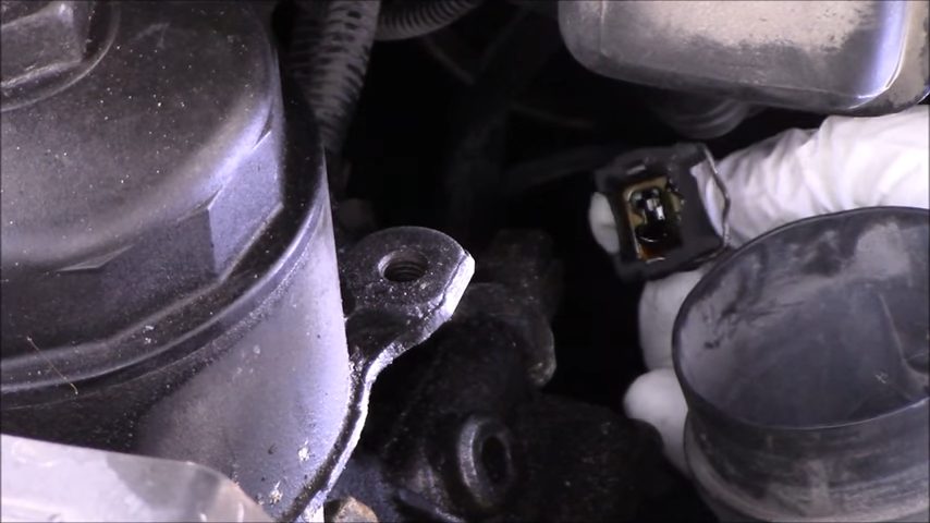 disconnecting the oil pressure sensor's electrical connector