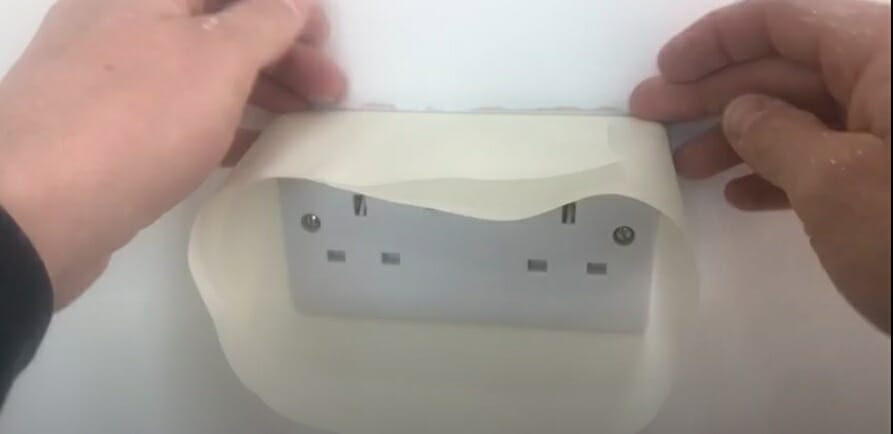 putting masking tape on socket outlet