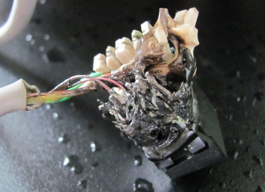a burnt light connector caused by a short circuit