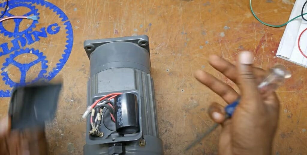 opening the motor to reveal the wire