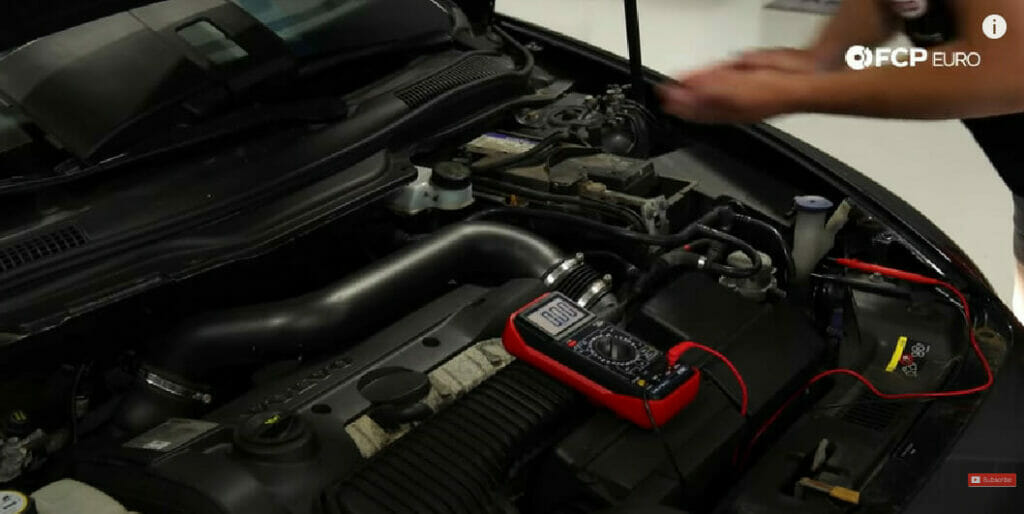 mechanic opening the car hood for checking