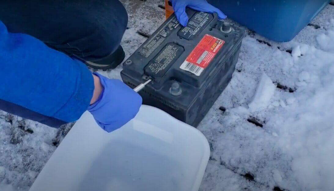 opening a battery to put sulfuric acid