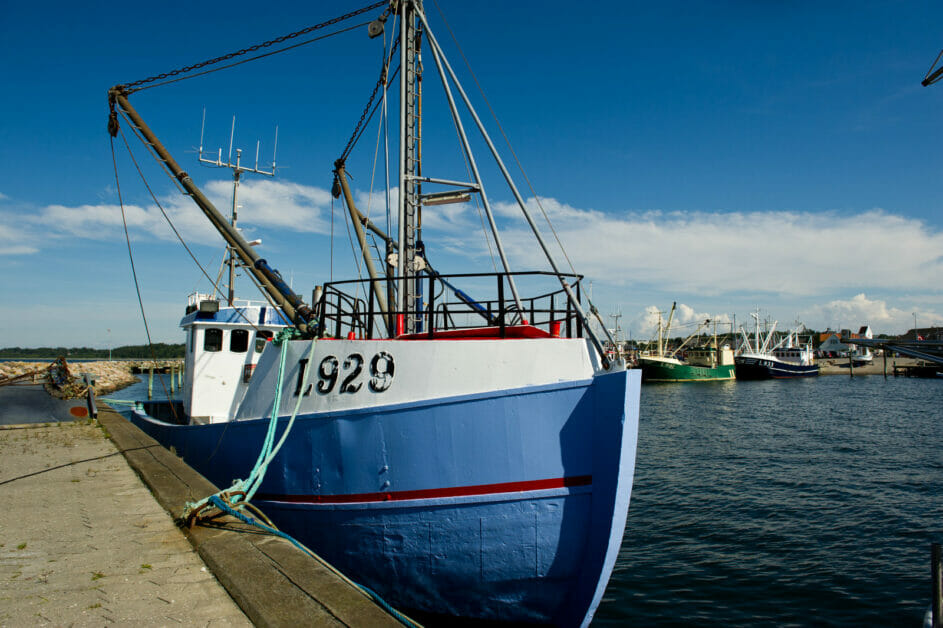 a fishing boat dock at the concrete shore