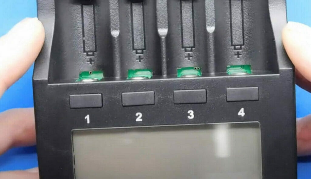 hand holding a AA Battery charger