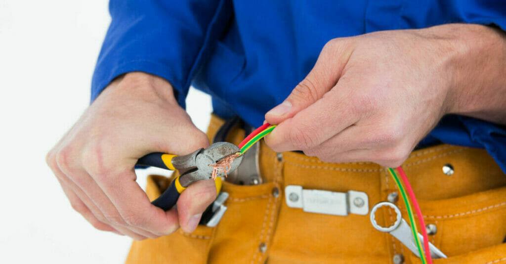 an electrician stripping wires
