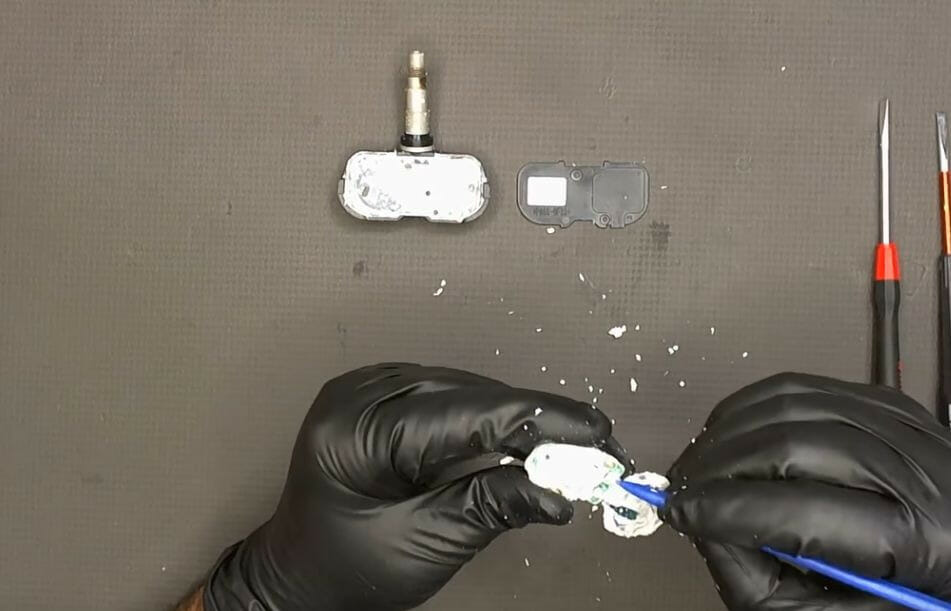 cleaning the central area using a plastic tool
