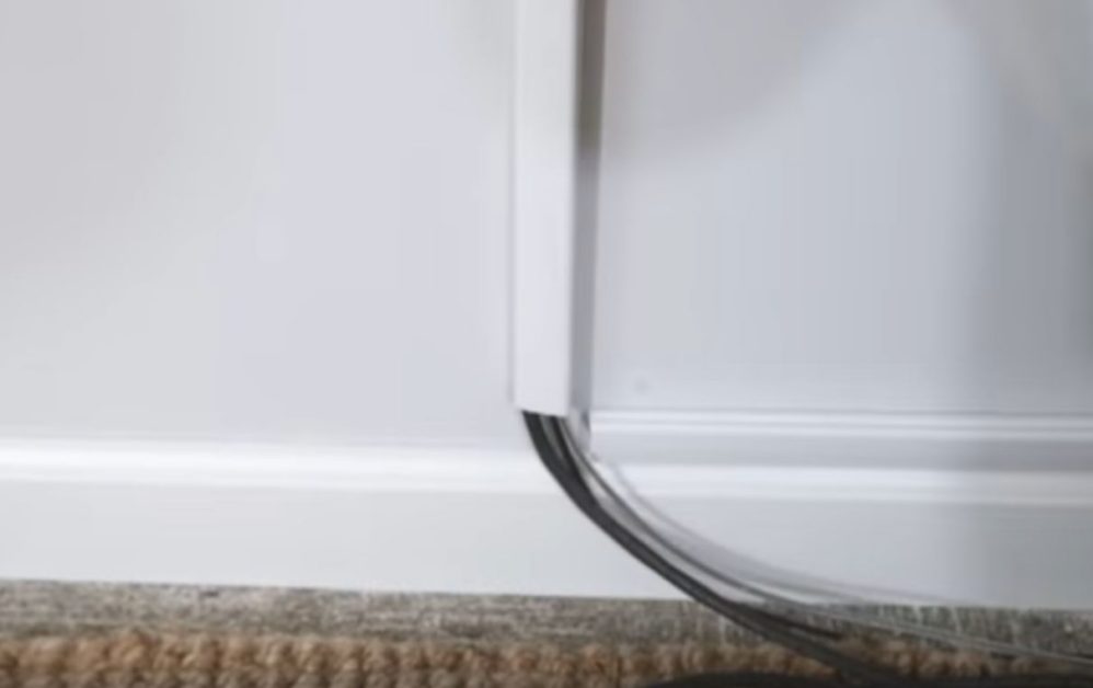 A wall mounted tv with a hidden cord