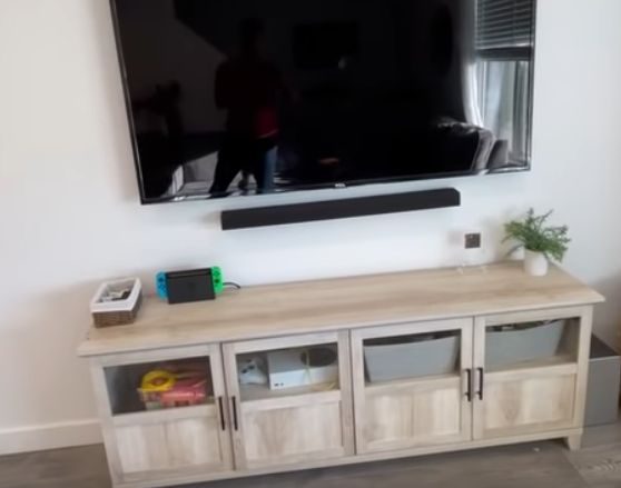 A sleek tv stand cleverly hides unsightly tv wires