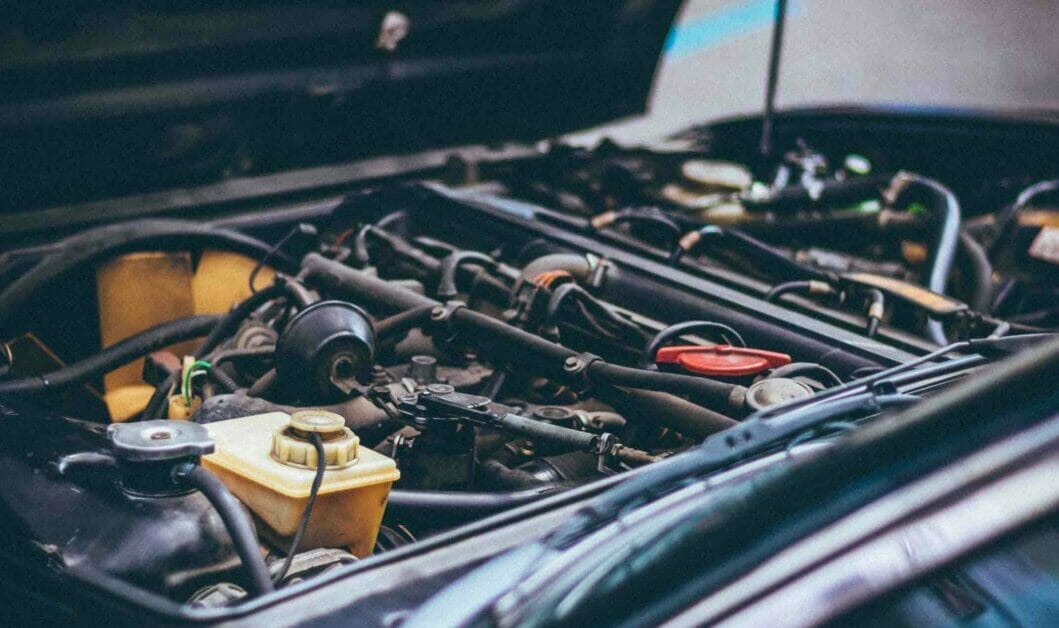 A closer look at a car engine in an open hood