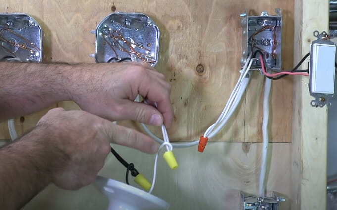 A person capping off the switch wire