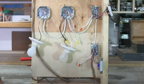 A demo on a 3-way light switch installed on a temporary wall