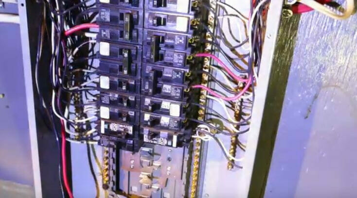 An electrical panel with wires attached