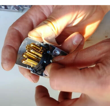 A person is holding a trailer plug's ends