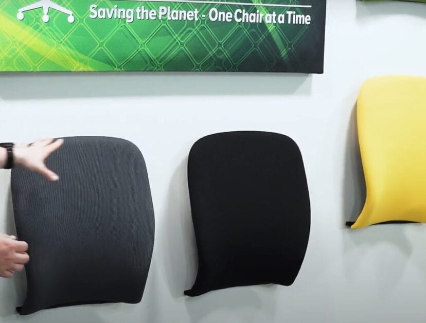 A person holding a bio-based upholstery back rest cushion