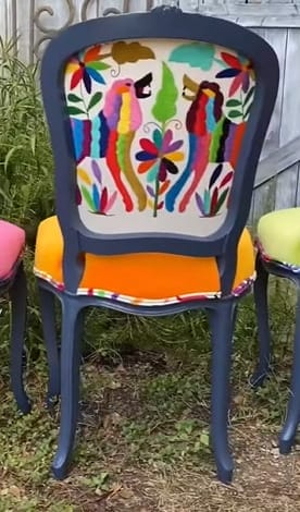 A chair with colorful upholstery covers