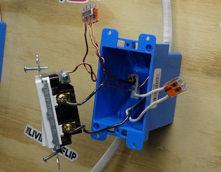 A blue box with ground wire attached