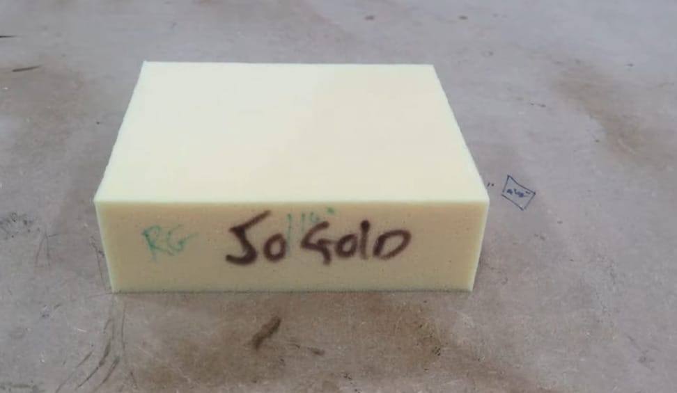 A yellow block of foam with the word 50 Gold