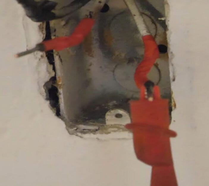 Attach one probe to the near end of the main wire
